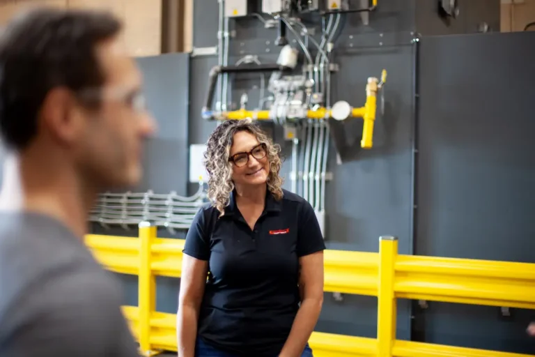ShearCore Team member, Tonya, smiling in the factory