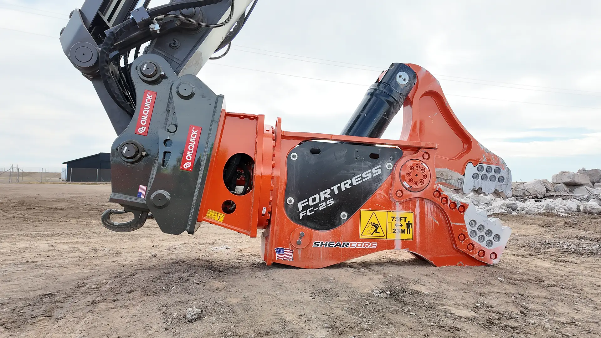 FC25 Demolition Tool with OilQuick coupler sitting in a demolition site